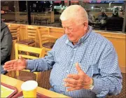  ?? Michelle Wilson / RN-T ?? David Lewis describes the size of the fish he caught during a recent fishing trip to Louisiana.