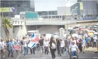  ?? (Miriam Alster/Flash90) ?? VETERANS AND disabled soldiers block the Ayalon Highway in protest outside the Defense Ministry in Tel Aviv yesterday.