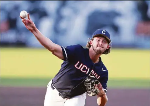  ?? Gail Burton / Associated Press ?? UConn pitcher Pat Gallagher throws against Maryland last week. Gallagher will start Game 1 of Saturday’s Super Regional at Stanford.