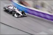  ?? RYAN SUN — THE ASSOCIATED PRESS ?? Team Penske driver Josef Newgarden races during a qualifying session for the IndyCar Grand Prix of Long Beach last Saturday in Long Beach.