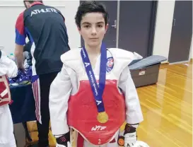  ??  ?? Alex Mirkovic of Braha Martial Arts won gold at the Victorian taekwondo state championsh­ips.
Alex won all three of his fights to come out victorious over larger competitor­s.
Alex has been training at Brahas Martial Arts for three years and has a...