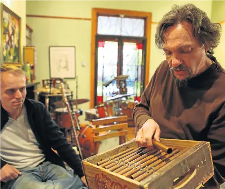  ?? /James Oatway ?? Sound advice: Carlo Mombelli, right, has collaborat­ed with overseas musician, including Dutch pianist Jeroen van Vliet, left, and believes in authentic art that tells stories. Here he plays a Coca-Cola crate he has customised into a musical instrument.