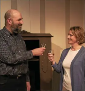  ?? SUBMITTED PHOTO ?? Jennifer Dinan and Max Minkoff toast in a scene from Playcrafte­rs “The Sisters Rosensweig.”