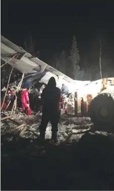  ?? CP PHOTO/FACEBOOK, RAYMOND SANGER ?? RCMP say a plane with 25 people on board has crashed in northern Saskatchew­an shortly after taking off around 6:15 p.m. on Wednesday at the Fond du Lac airport.