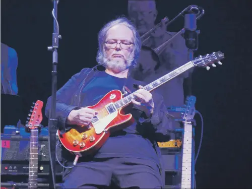  ??  ?? Walter Becker playing guitar with Steely Dan in concert at the Beacon Theatre, New York, last year.