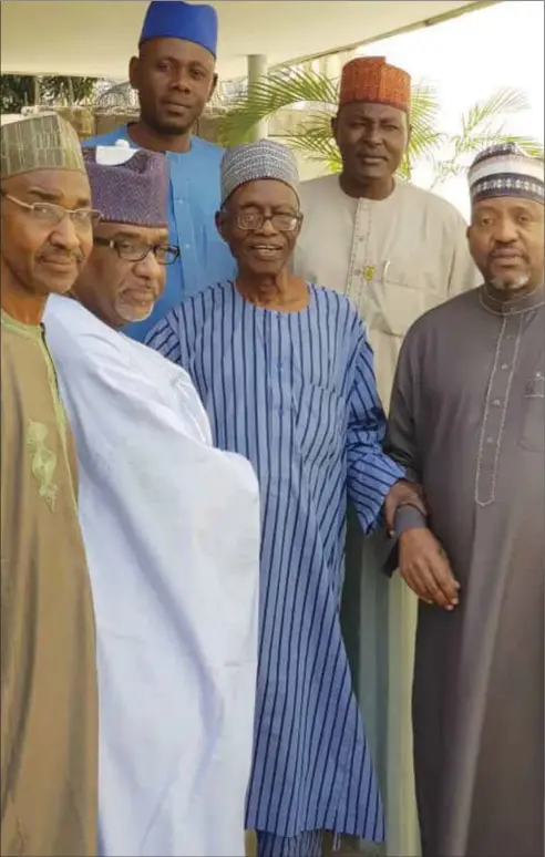  ??  ?? L-R: Mallam Bilya Bala, Mouftah Baba-Ahmed holding the late sage, Mallam Adamu Ciroma, and Dr. Aliyu Modibbo, also holding Mallam Adamu (may his soul Rest In Peace, amin). Back row, L-R, Dr. Umaru Pella, and Mallam Rabi’u Dagari (both of the APDS Secretaria­t).