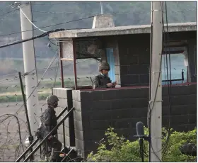  ?? (AP/Ahn Young-joon) ?? Soldiers enter a guard post Sunday in Paju, South Korea, near the border with North Korea.