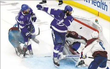  ?? Chris O'Meara Associated Press ?? TAMPA BAY left wing Pat Maroon (14) scores past Colorado goaltender Darcy Kuemper during the second period of Game 3 of the Stanley Cup Final. Kuemper was removed from the game after giving up five goals.