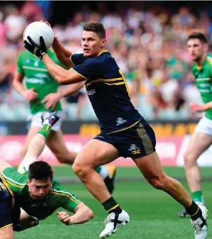  ?? MARK BRAKE/GETTY IMAGES ?? Dayne Zorko of Australia bursts forward as Ireland’s Paul Murphy (left) finds himself wrestled to the ground during the first Test in the Adelaide Oval