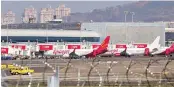  ?? PHOTO:PTI ?? Aircraft stand at the Mumbai Internatio­nal Airport as the runway remained closed for maintenanc­e activities on Tuesday