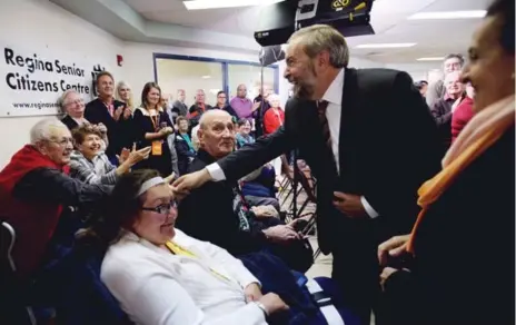  ?? SEAN KILPATRICK/THE CANADIAN PRESS ?? NDP Leader Thomas Mulcair meets voters during a campaign stop at the Regina Senior Citizens Centre in Saskatchew­an on Friday.