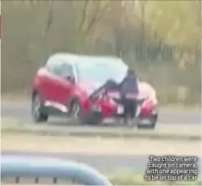  ??  ?? Two children were caught on camera, with one appearing to be on top of a car