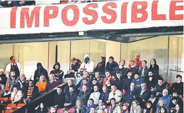  ?? — AFP photo ?? Manchester United’s French midfielder Paul Pogba (top centre), dressed in white, sits in the stands during the English League Cup third round match between Manchester United and Derby County at Old Trafford in Manchester, north west England in this Sept 25 file photo.