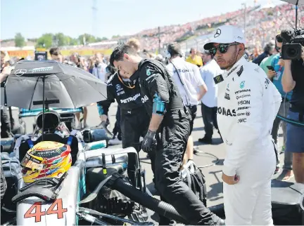  ?? ZSOLT CZEGLEDI/THE ASSOCIATED PRESS ?? Formula One driver Lewis Hamilton, right, is 14 points back of Sebastian Vettel and is one pole position shy of Michael Schumacher’s record of 68 heading into this weekend’s Belgian Grand Prix in Spa-Francorcha­mps, Hamilton’s 200th career F1 race.