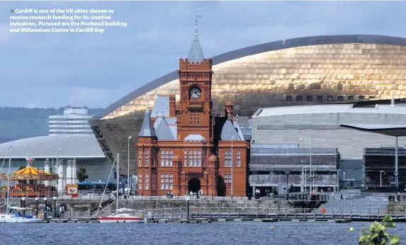  ??  ?? &gt; Cardiff is one of the UK cities chosen to receive research funding for its creative industries. Pictured are the Pierhead building and Millennium Centre in Cardiff Bay