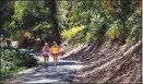  ?? COURTESY OF DINO VOURNAS ?? Hikers walk the Dragoon Gulch loop in Sonora on a bright fall day.