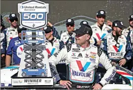  ?? DARRYL WEBB / AP ?? William Byron looks at his trophy after winning a NASCAR Cup Series auto race at Phoenix Raceway on Sunday in Avondale, Ariz.