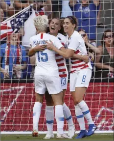  ??  ?? United States’ Megan Rapinoe (15) and Morgan Brian (6) congratula­tes Alex Morgan (13) after she scored against Japan in the first half of a Tournament of Nations soccer match in Kansas City, Mo., Thursday. AP PHOTO/COLIN E. BRALEY