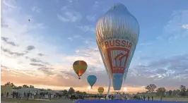  ?? MORTON VIA AGENCE FRANCE-PRESSE ?? The hot-air balloon named “Morton,” which is flown by Russian adventurer Fedor Konyukhov, takes to the skies July 12 for a round-the-world trip from Northam in Western Australia. Konyukhov claims a new record flying solo around the world in 11 days.