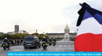  ?? — AFP ?? PARIS: The hearse transporti­ng the coffin of French Brigadier Ronan Pointeau of the French Army 1st Spahi Regiment in Valence crosses the Alexandre III bridge in Paris on his way to the Invalides (Hotel des Invalides), for a military tribute.