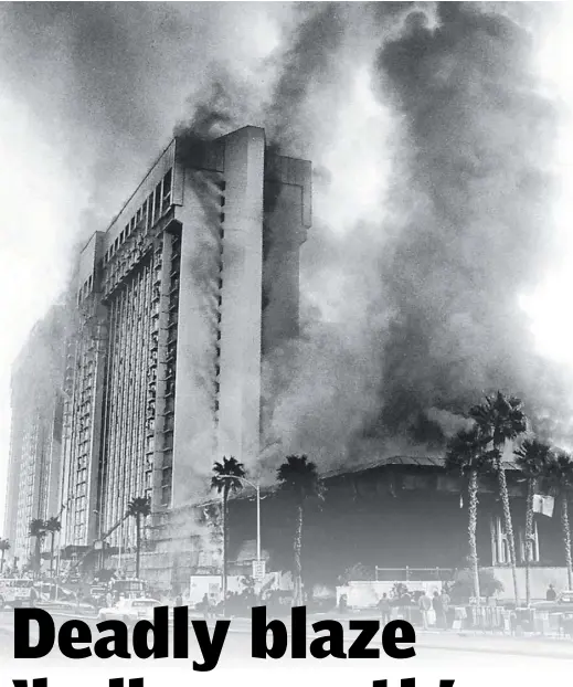  ?? Las Vegas Review-Journal ?? Smoke billows as fire rages through the MGM Grand on Nov. 21, 1980. The worst blaze in Las Vegas history killed 87 people and injured hundreds more inside the Strip property, now Bally’s. More than 1,350 legal claims stemmed from the fire sparked by faulty wiring in a deli restaurant.