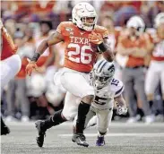  ?? Nick Wagner / TNS ?? Texas’ Keaontay Ingram rushed for a career-best 139 yards and two scores to help beat Kansas State.