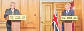  ?? Photo ?? Britain’s new Deputy Chief Medical Officer for England Jonathan Van-Tam (L) speaks as Dowden (R) listens at a remote press conference to update the nation on the COVID-19 pandemic, inside 10 Downing Street in central London.