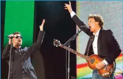  ??  ?? In this July 2, 2005, file photo, George Michael, left, and Paul McCartney, right, perform during the Live 8 concert in Hyde Park, London.