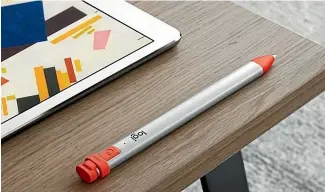  ??  ?? The Logitech Crayon’s rubbery orange accents makes it easy to grab out of your bag.