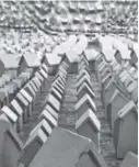  ??  ?? Boulder sculptor Adam Junior made 15,333 tiny cement houses for a recent art show in Fort Collins.