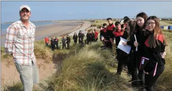  ??  ?? Dr Eugene Farrell explaining the forces of erosion to Meanscoil Nua an Leith Triúigh students who helped transplant marram grass at Maharbeg Cut in June and (below) the fruits of their labour showing the entrance to Maharabeg Cut in March 2016 (left)...