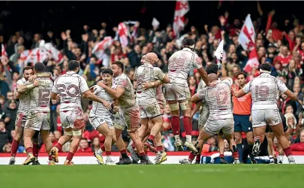  ?? GETTY IMAGES ?? Georgia players celebrate their historic win over Wales in Cardiff yesterday.