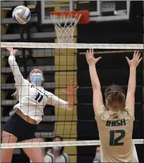  ??  ?? Maggie Peitz of Regina attacks the ball during a Division 2 state quarterfin­al match against Notre Dame Prep at L’Anse Creuse North.