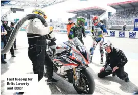  ??  ?? Fast fuel-up for Brits Laverty and Iddon