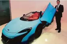  ?? Zarina Fernandes/ Gulf News ?? Andreas Bareis with the 675LT Spider at the new McLaren UAE showroom on Shaikh Zayed Road, Dubai.