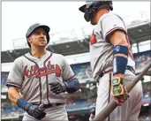  ?? AP - Patrick Semansky ?? The addition of Adam Duvall, left, has breathed new life into the Braves’ offense, going into a four-game series with the Reds this weekend at Suntrust Park.