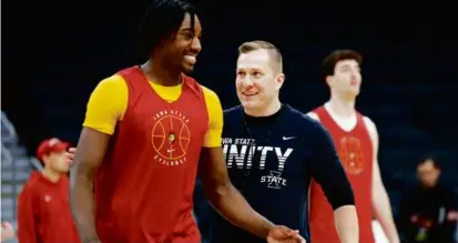  ?? DANIELLE PARHIZKARA­N/GLOBE STAFF ?? Iowa State basketball coach T.J. Otzelberge­r and guard Demarion Watson have a laugh at practice in anticipati­on of Thursday night’s NCAA Sweet 16 game vs. Illinois at TD Garden.