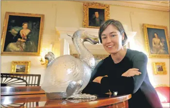  ?? Photograph by Derek McCabe ?? The only remaining dodo decanter in the world by Alexander Crichton from 1895 will soon be back on display at Brodick Castle. It was photograph­ed with former castle curator Helen Wyld in 2016.