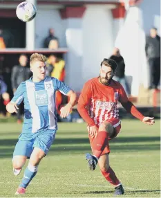  ??  ?? Seaham Red Star (red and white) battle in vain against Whitley Bay in last weekend’s 2-0 home defeay. Pictures by Tim Richardson