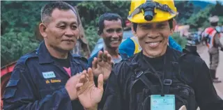  ?? Picture: GETTY ?? Rescue workers were all smiles after the boys were brought to the surface.