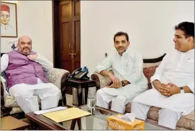  ??  ?? BJP president Amit Shah during a meeting with Rashtriya Lok Samata Party leader Upendra Kushwaha (C) and BJP leader Bhupender Yadav in New Delhi in June. PTI