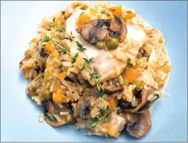  ?? Associated Press photo ?? This photo shows an under-pressure quickie chicken and rice in New York. Whether you make the Spanish staple, Arroz con Pollo or make up your own version, it is soul-satisfying and perfect for the cooler weather.