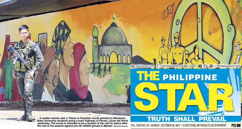  ??  ?? A soldier stands near a ‘Peace is Possible’ mural painted by Mindanao State University students along a main highway of Pantar, Lanao del Norte yesterday. The mural is intended to be a symbol of the call for peace after the end of the assault against...