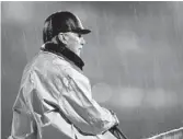  ?? CHARLIE RIEDEL/AP ?? Legendary trainer D. Wayne Lukas watches a horse workout in the rain at Churchill Downs on Tuesday in Louisville, Ky.