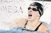  ?? Michael Sohn / Associated Press ?? American Katie Ledecky won the 800-meter freestyle at the world swimming championsh­ips Saturday, breaking her world record by 3.61 seconds.