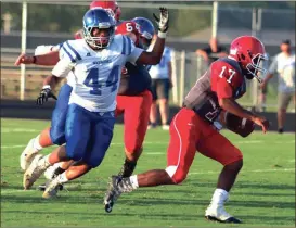  ?? LARRY GREESON / For the Calhoun Times ?? Sonoravill­e’s Patrick Moore (17) looks for running room as he is pursued by Gordon Central’s Dorian McConnell (44).