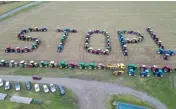  ?? ?? TRACTORS positioned to read ‘STOP !’ during a farmers’ protest over a number issues affecting their sector, in Maille, central France. The unions have demanded concrete government action to address their grievances, which they say include excessive financial charges and environmen­tal protection rules as well as insufficie­nt prices for their produce.