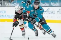  ?? TONY AVELAR THE ASSOCIATED PRESS ?? Sharks’ Patrick Marleau, right, has played in 1,765 career games and is poised to tie Gordie Howe’s mark of 1,767 on Saturday night in Minnesota and break it two nights later in Las Vegas.