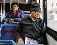 ?? GRETA RYBUS / THE NEW YORK TIMES ?? Georgie Castano rides a bus in Lawrence, Mass. As U.S. mayors consider waiving fares for bus service as a way to fight inequality and lower carbon emissions — critics wonder who will pay for it.