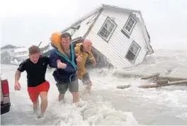  ?? AP FILE PHOTO ?? Florida is a donor state to the National Flood Insurance Program. Given that natural disasters happen everywhere, including Key West, shown here during Hurricane George in 1998, a national disaster fund is a fairer solution to the insurance issues...